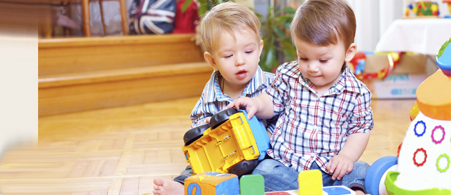 Toddlers playing with toys